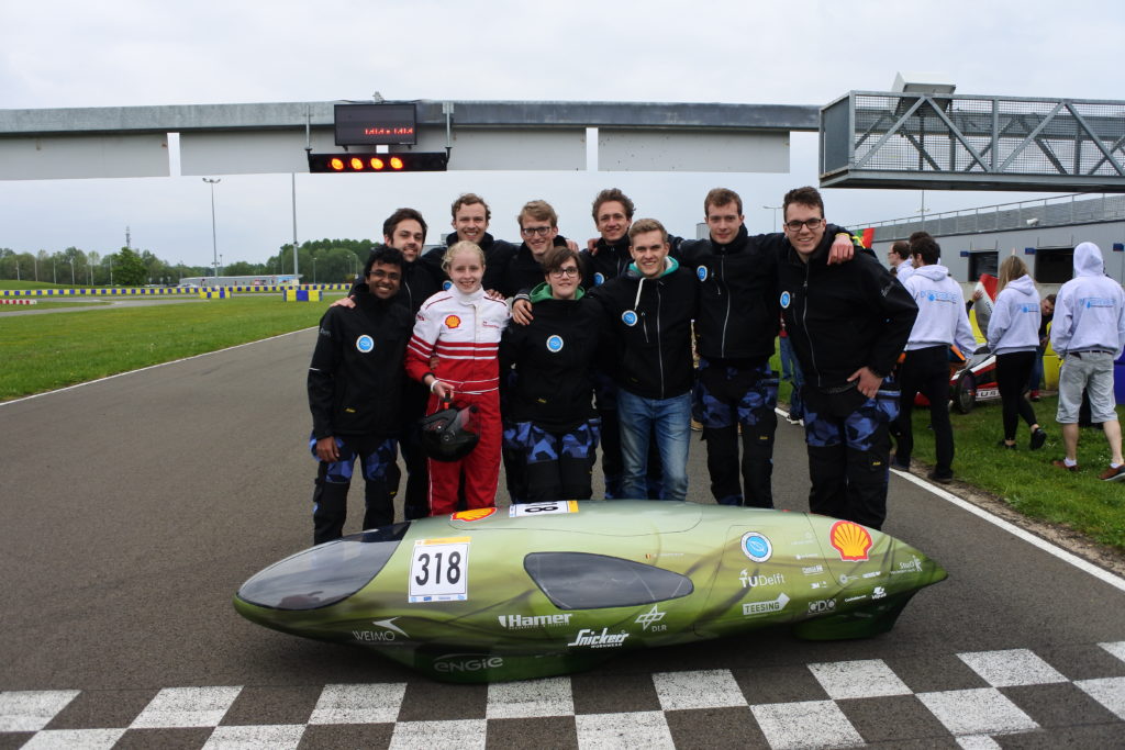 Eco-Runner and team on racetrack